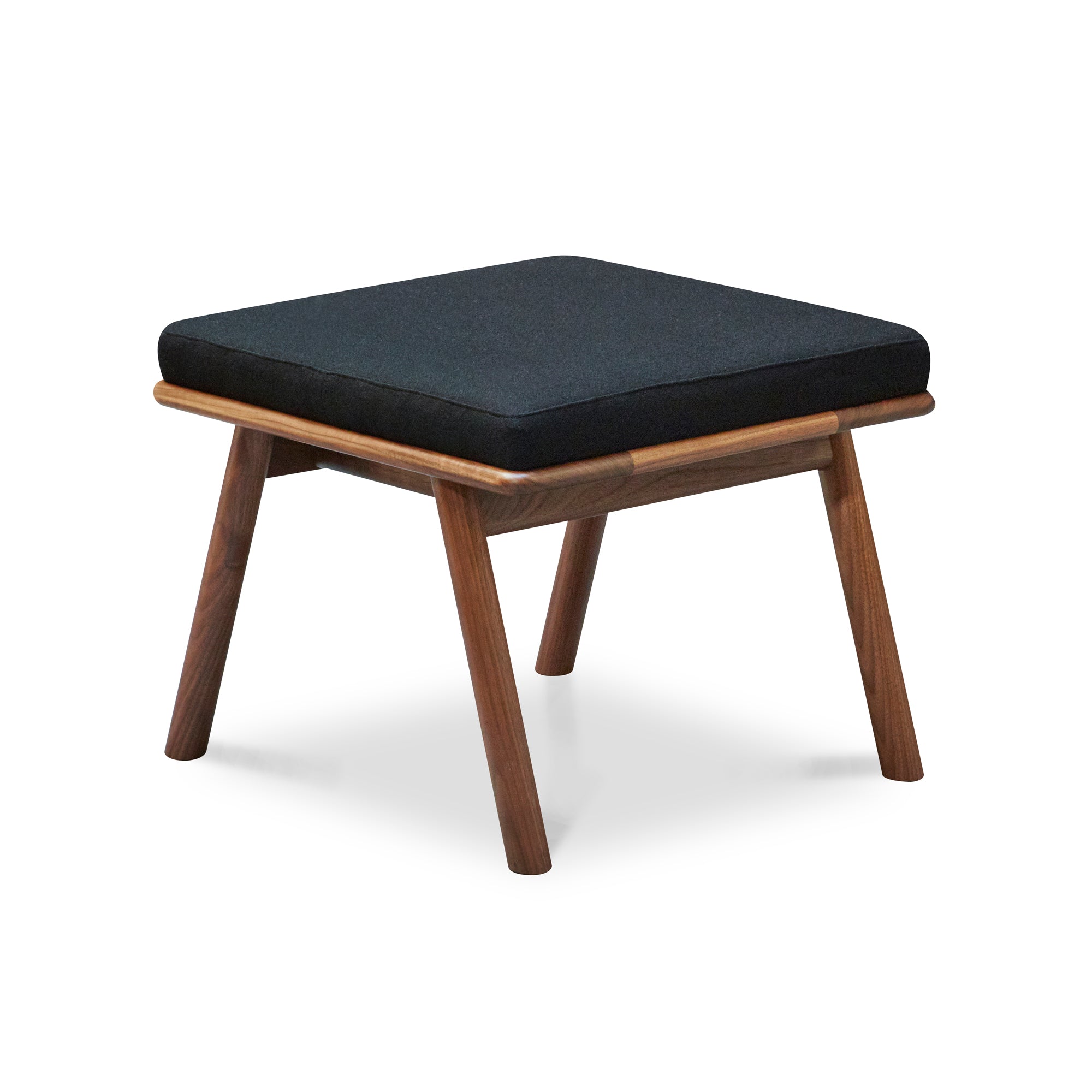 Solid walnut wood Scandinavian style Nautilus Ottoman with Knoll fabric cushions in Black, from Maine's Chilton Furniture Co.