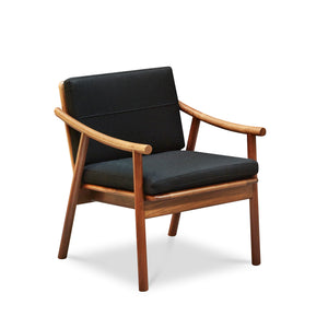 Solid walnut Scandinavian style lounge chair with Knoll fabric cushions in black, from Maine's Chilton Furniture Co.