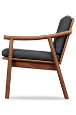 Side view of solid walnut Scandinavian style lounge chair with Knoll fabric cushions in Charcoal, from Maine's Chilton Furniture Co. 