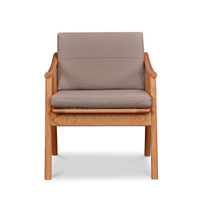 Front view of solid cherry Scandinavian style lounge chair with Knoll fabric cushions in Putty, from Maine's Chilton Furniture Co. 