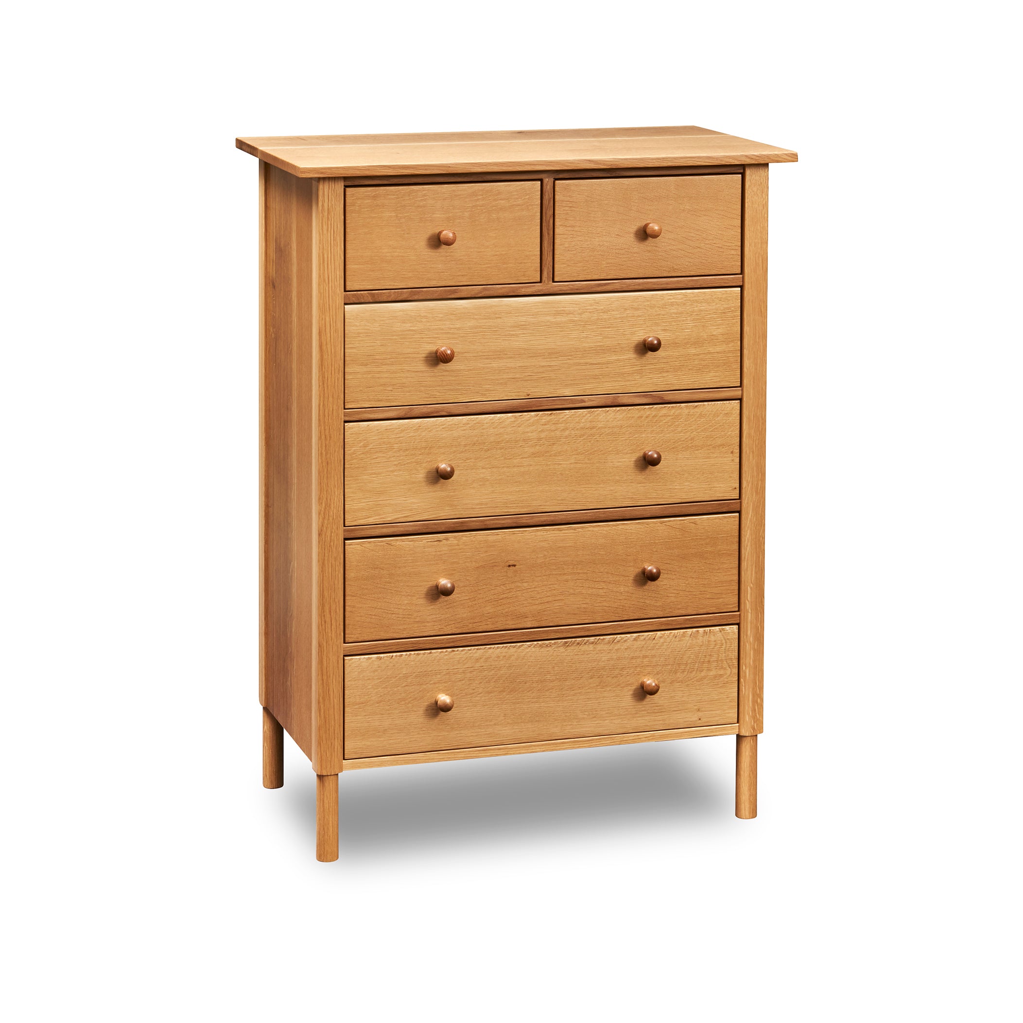 Modern interpretation of a classic Shaker style chest with six drawers and rounded legs, in solid white oak wood