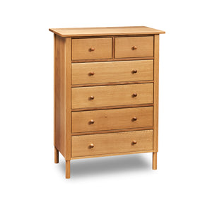 Modern interpretation of a classic Shaker style chest with six drawers and rounded legs, in solid white oak wood
