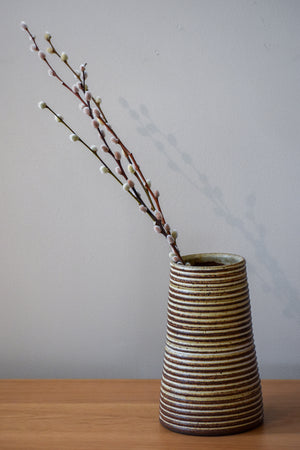 Striped cream and black reverse tapered vase with willow sprigs