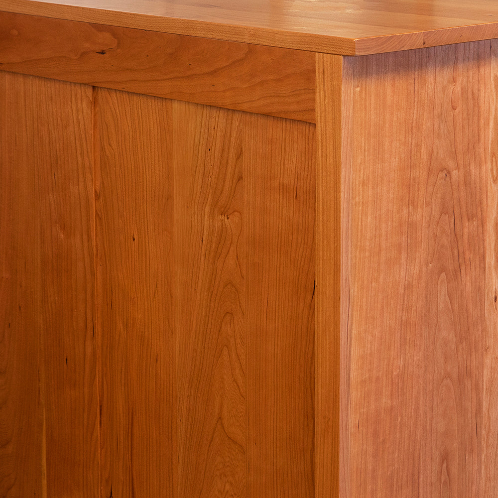 Finished solid cherry wood back of Acadia bedroom storage chest