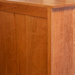 Finished solid cherry wood back of Acadia bedroom storage chest