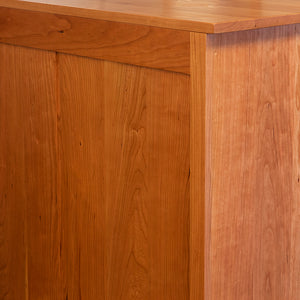 Finished solid cherry wood back of Acadia bedroom storage chest