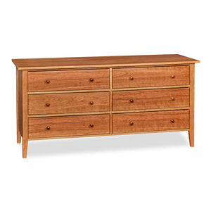 Modern interpretation of a classic Shaker style dresser with six drawers and square tapered legs, in solid cherry wood