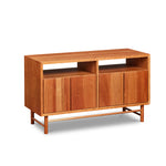 Mid-century modern Navarend media case in solid cherry wood with round legs and stretchers and four doors with storage space