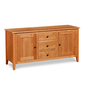 Cherry wood Salmon Falls Media Console with three centered drawers with storage shelves behind doors on both sides