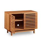 Modern slatted media stand with one of two doors open from Chilton Furniture in small size and cherry wood