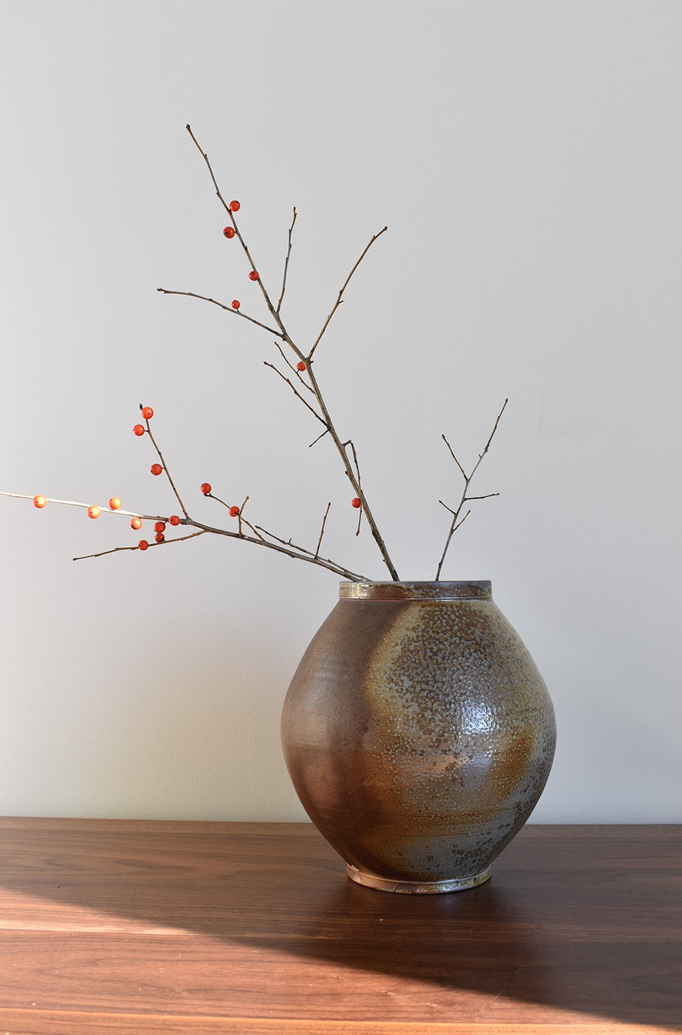 Round dark speckled pottery vase
