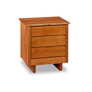 Chilton Furniture's Acadia Live Edge collection three drawer cherry bedroom nightstand with under drawer pulls and panel base
