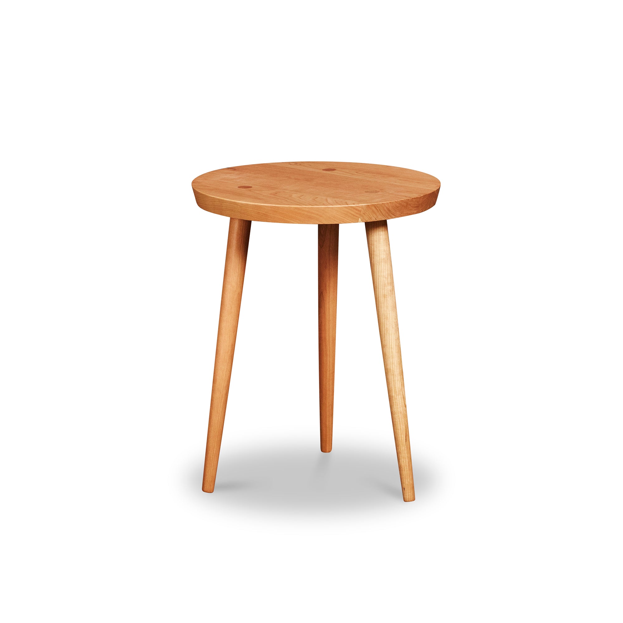 Modern round cherry wood nightstand with three round tapered legs