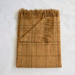 Soft burnt yellow checker patterned merino throw blanket