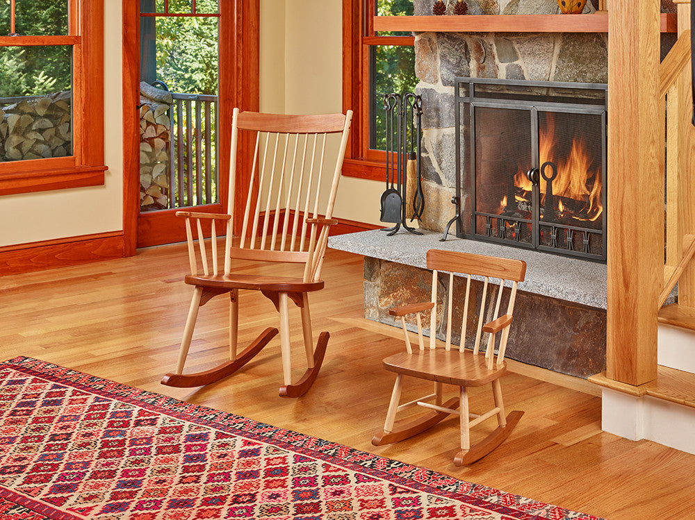 Cozy living room with fireplace and two solid cherry rockers with rounded maple spindles, one adult and one child sized