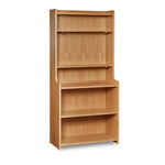 Tiered bookcase with rounded corners, built in white oak.