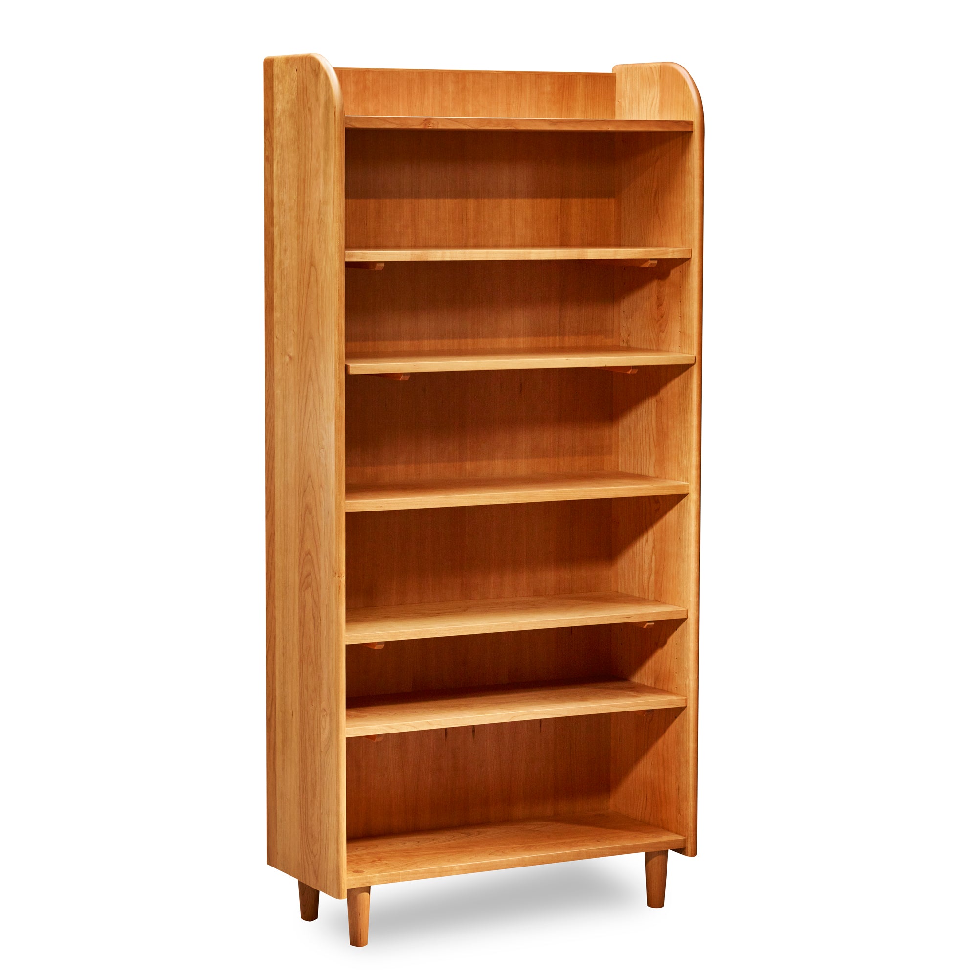 Tall bookshelf with open top, rounded corners, and round tapered legs, in cherry wood.