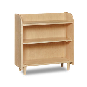 Bookshelf with open top, rounded corners, and round tapered legs, in maple wood.