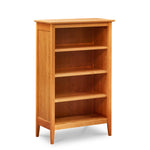 Four foot Shaker style bookcase with tapered legs in cherry