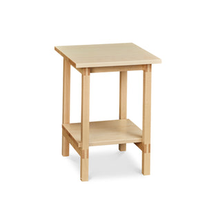 Modern trestle-style side table with visible joinery and low shelf in maple, from Maine's Chilton Furniture Co.
