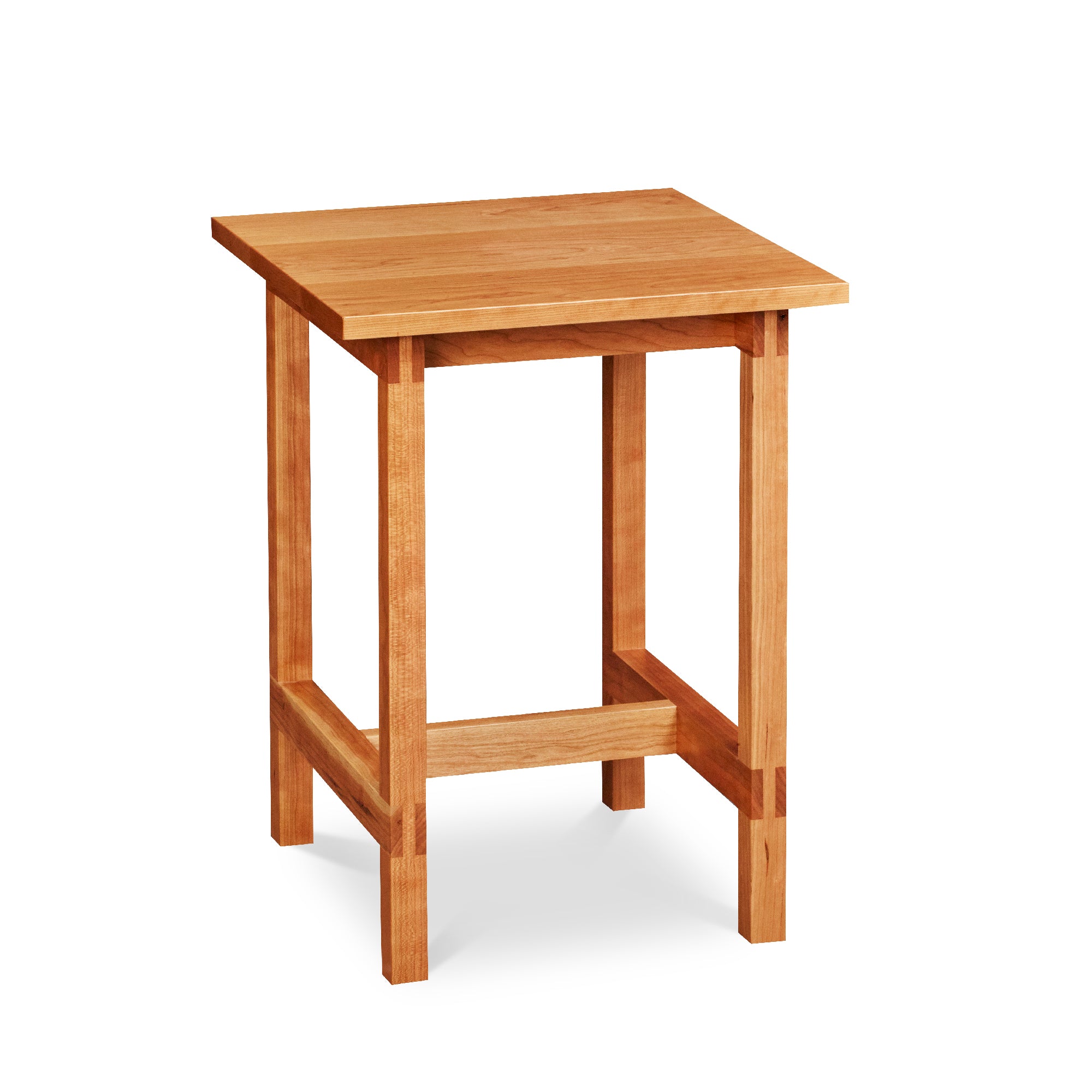 Modern trestle-style side table with visible joinery in cherry, from Maine's Chilton Furniture Co.
