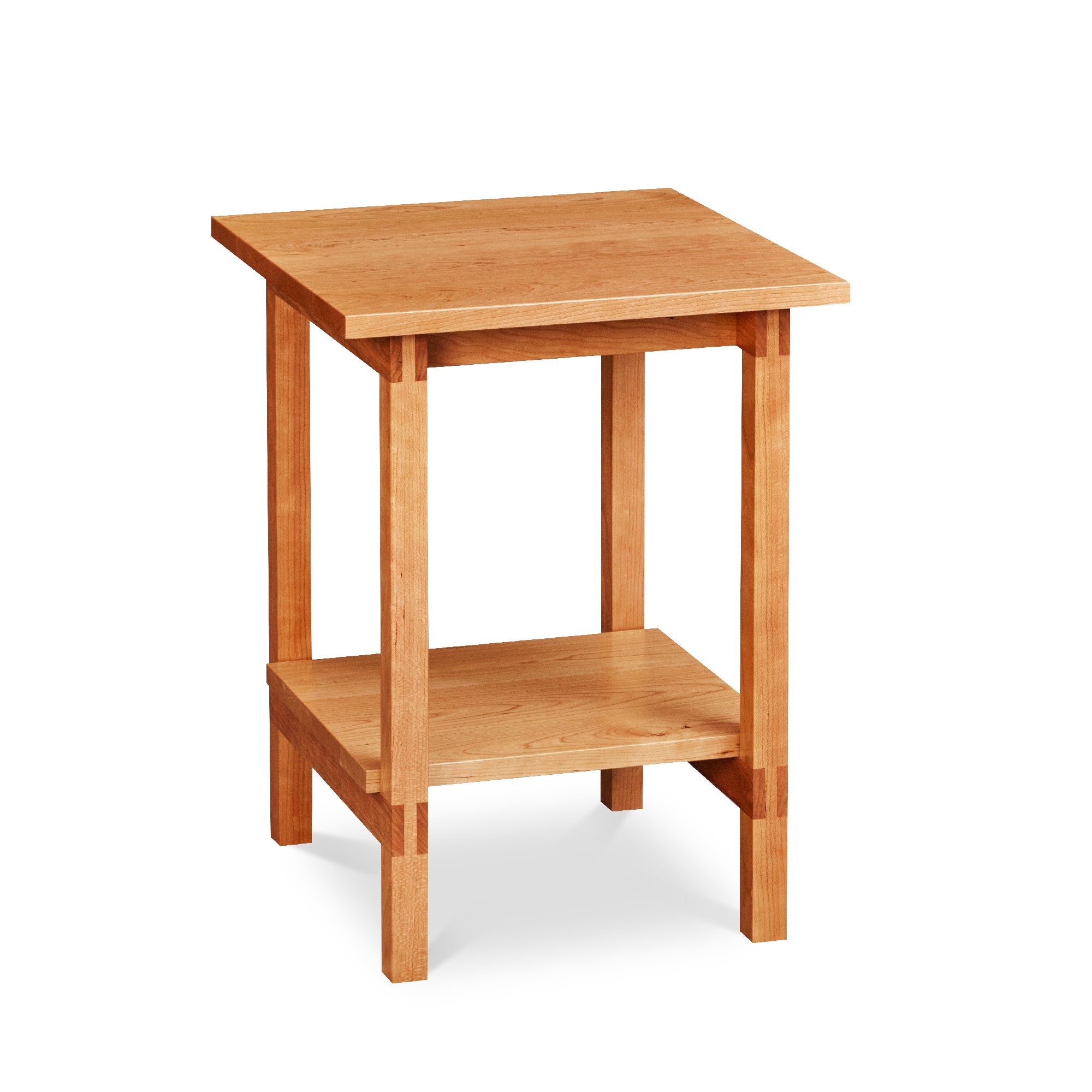 Modern trestle-style side table with visible joinery and low shelf in cherry, from Maine's Chilton Furniture Co.