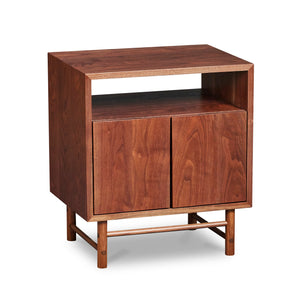 Mid-century modern Navarend media case in solid walnut wood with round legs and stretchers and two doors with storage space