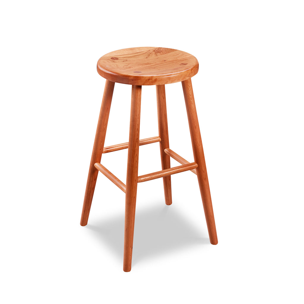 Simple round solid cherry wood stool, from Maine's Chilton Furniture Co.