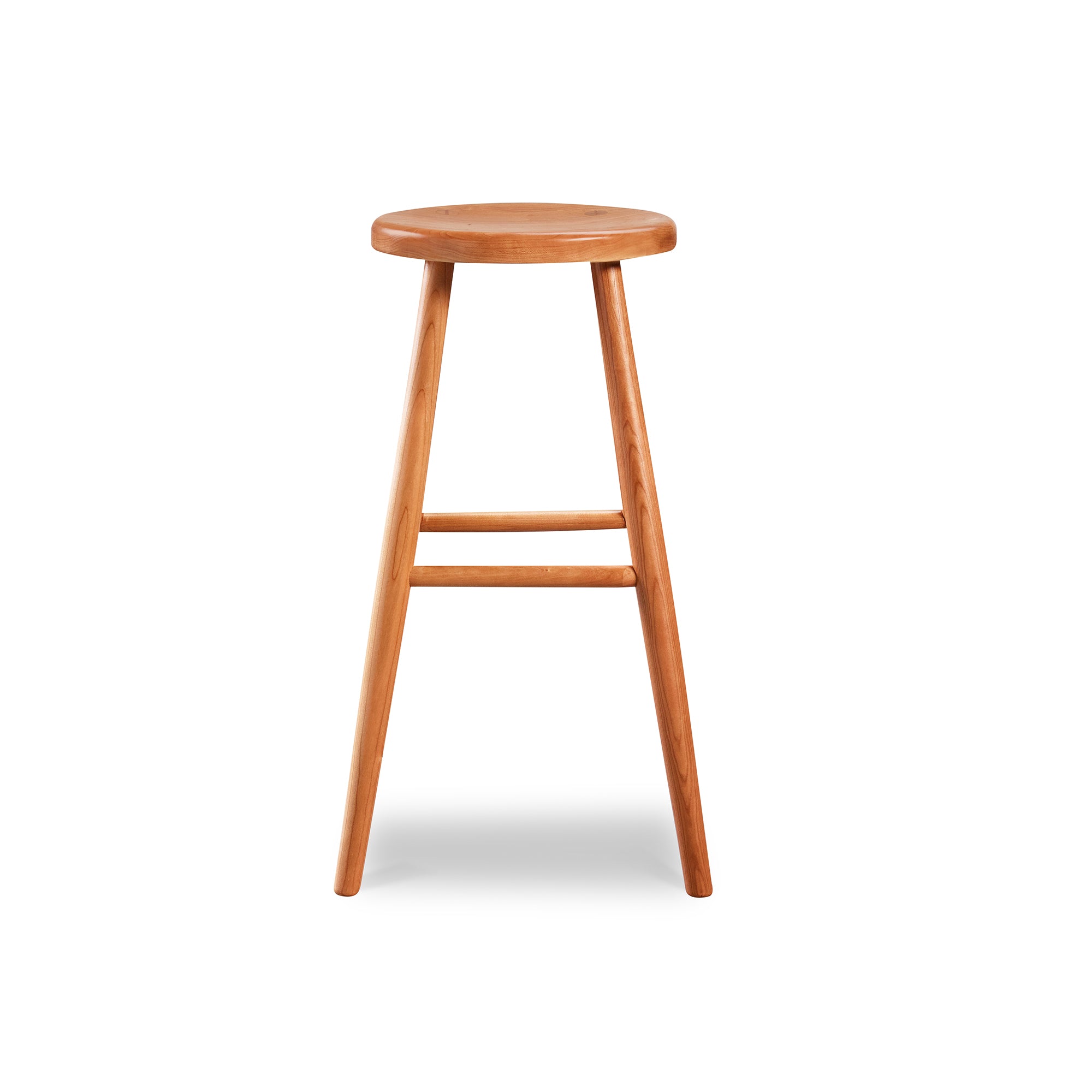 Simple round solid cherry wood stool, from Maine's Chilton Furniture Co.