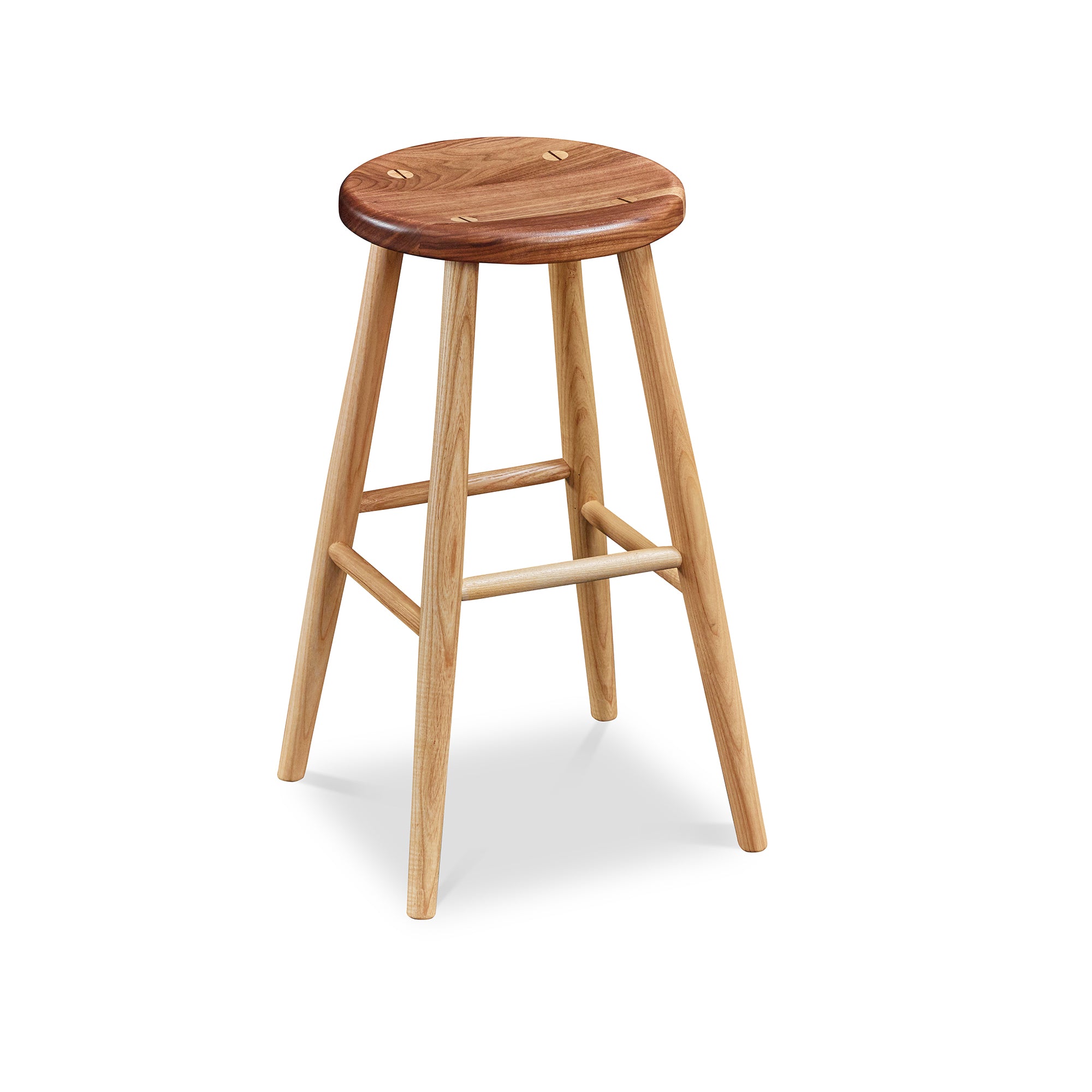 Simple round solid ash and walnut wood stool, from Maine's Chilton Furniture Co.