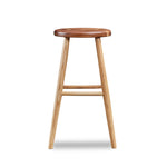 Simple round solid ash and walnut wood stool, from Maine's Chilton Furniture Co.