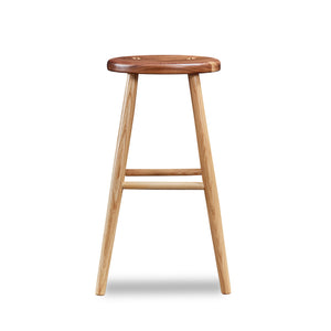 Simple round solid ash and walnut wood stool, from Maine's Chilton Furniture Co.