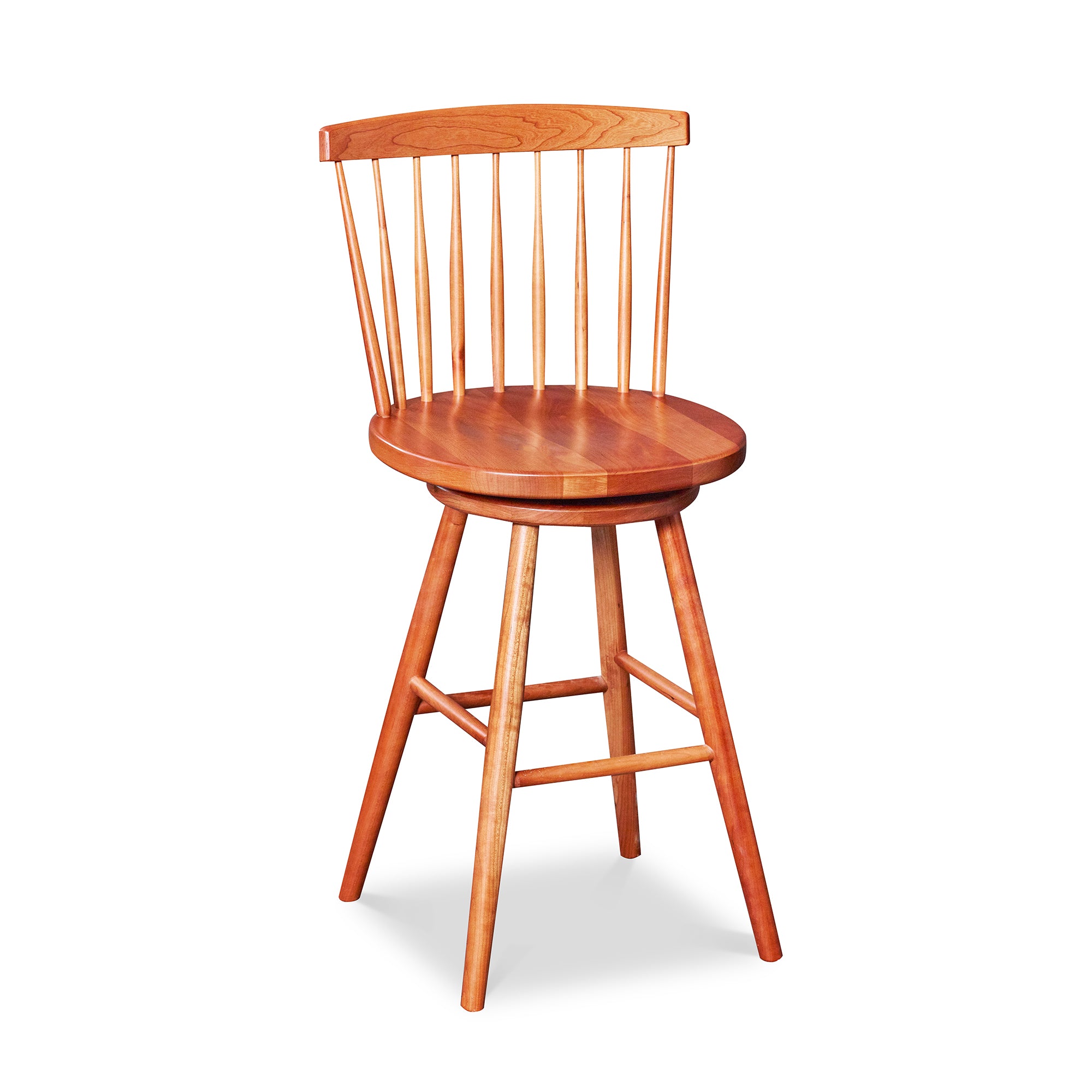 Cherry swivel counter stool with spindle back, from Maine's Chilton Furniture Co.