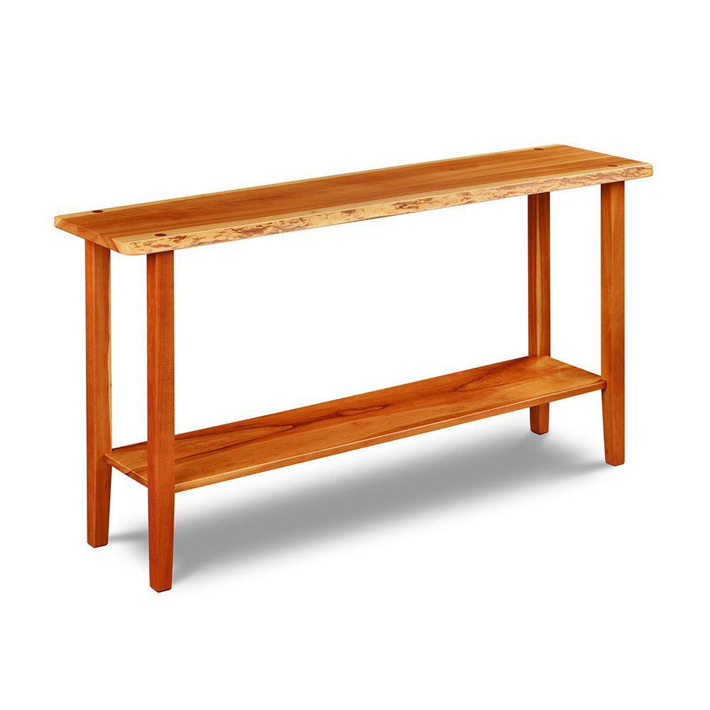 Live edge solid cherry sofa table with four post legs and low shelf, from Maine's Chilton Furniture Co. 