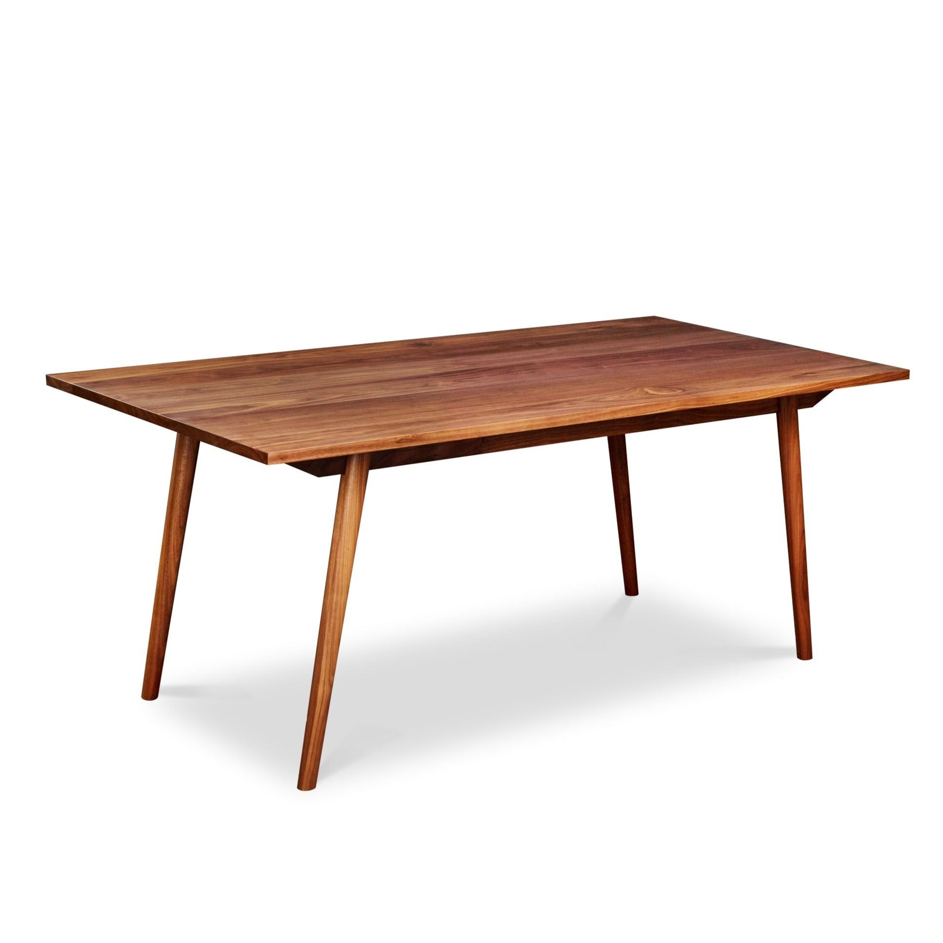 Mid-century Scandinavian rectangle dining table with angled legs in solid walnut wood