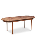 Modern solid walnut oval dining table with no leaves in
