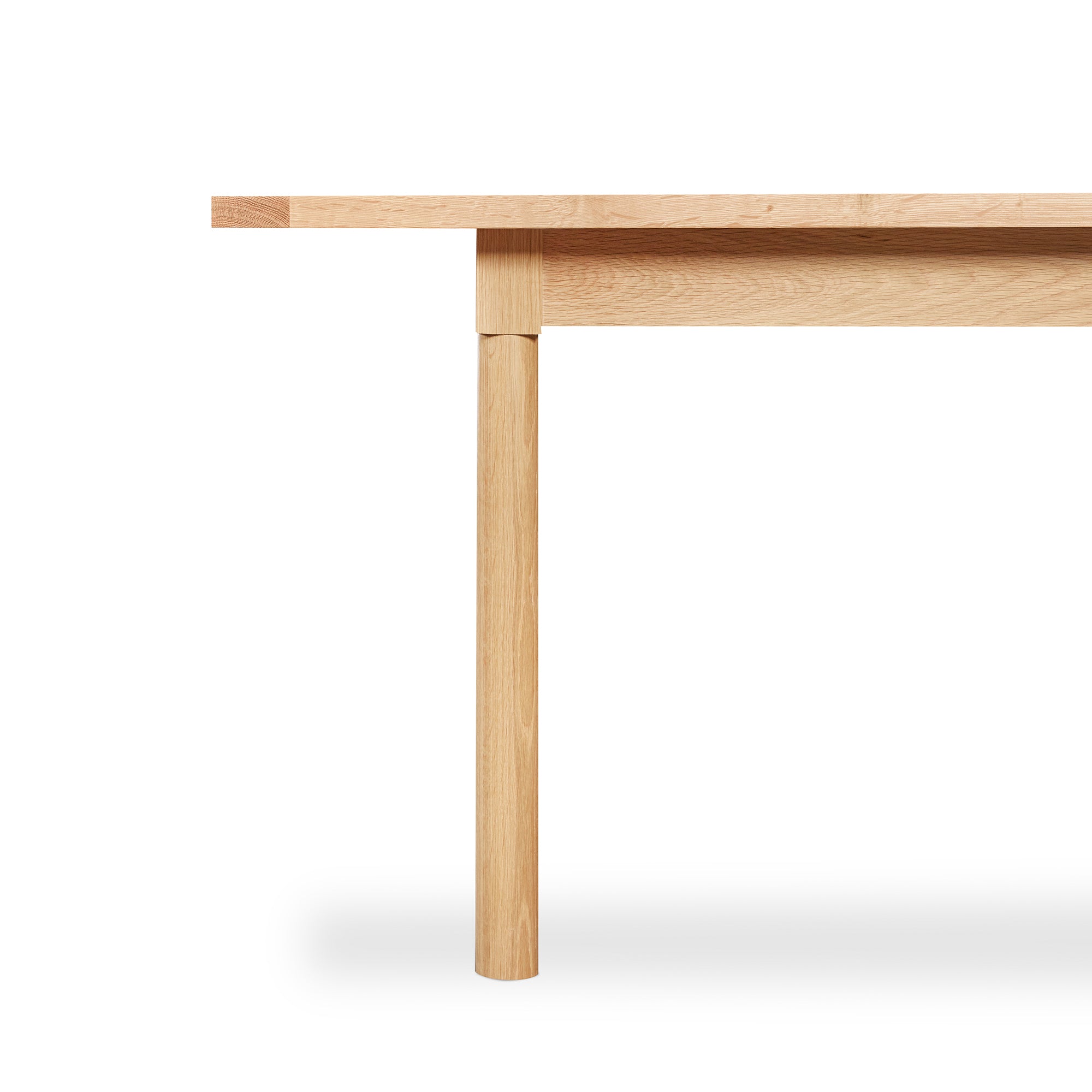 Detailed look of straight turned legs on Revelry dining table