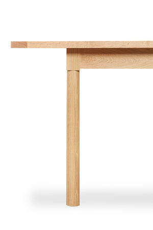 Detailed look of straight turned legs on Revelry dining table