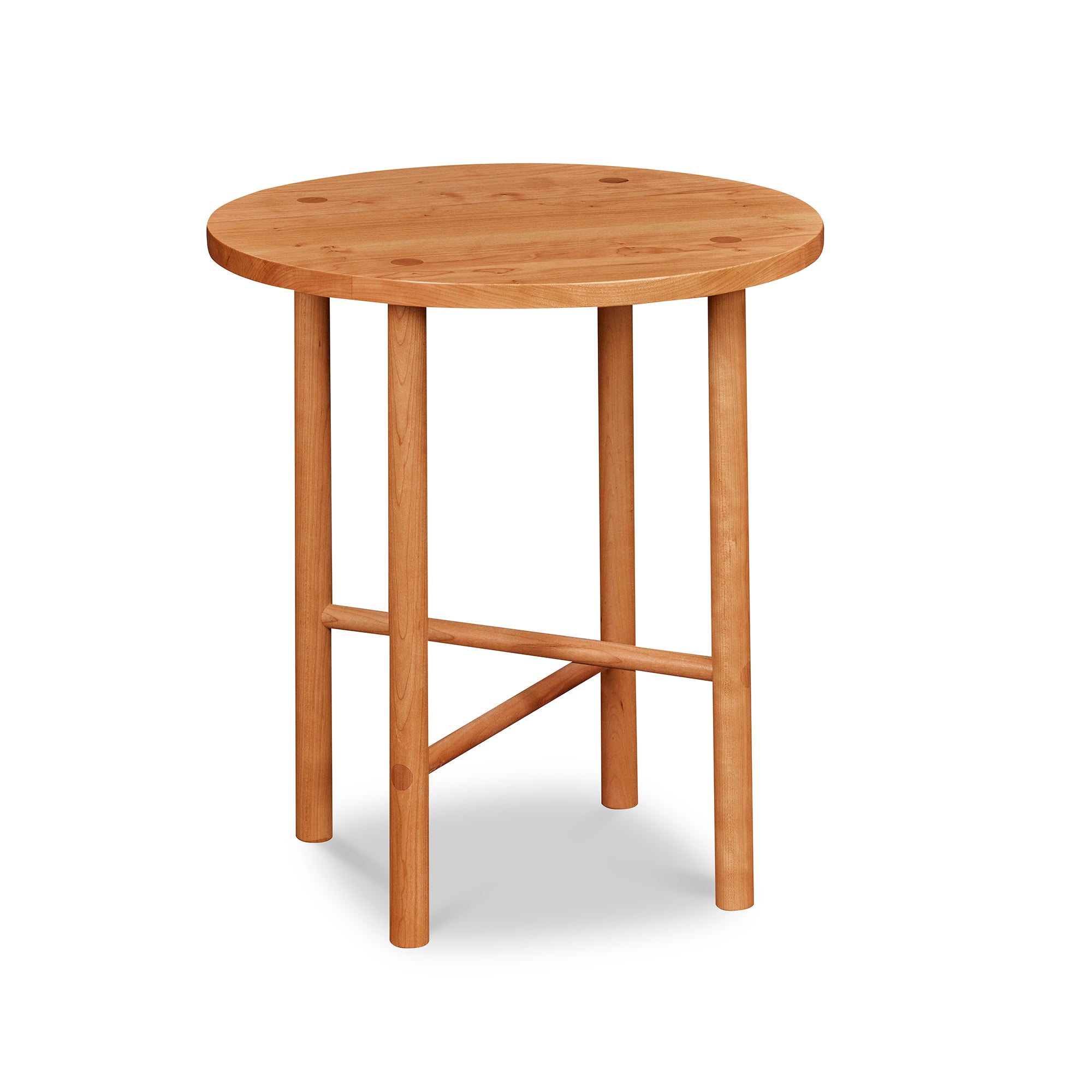 Round Scandinavian style end table with round legs in cherry