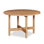 Modern round trestle table with visible joinery in white oak, from Maine's Chilton Furniture Co.