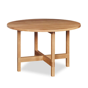 Modern round trestle table with visible joinery in white oak, from Maine's Chilton Furniture Co.