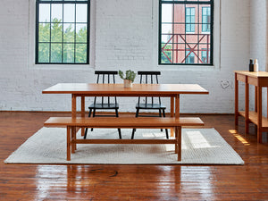 Warehouse loft dining room furnished with modern Union Sideboard, Table and Bench from Maine's Chilton Furniture Co. 