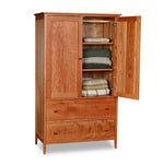 Classic cherry Shaker wardrobe with two drawers and two doors, one opened to reveal shelving and stored folded blankets