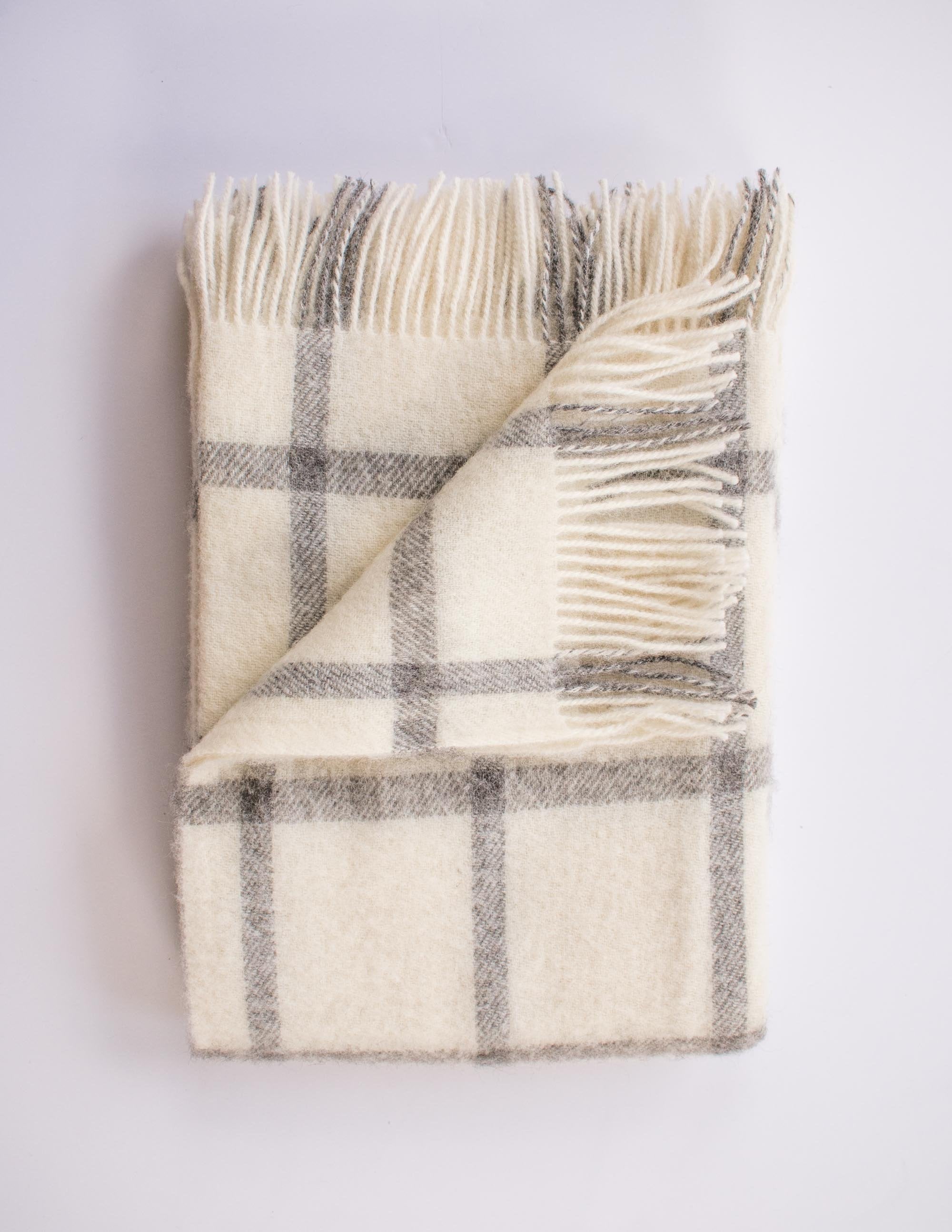 Soft white and grey checker patterned merino throw blanket