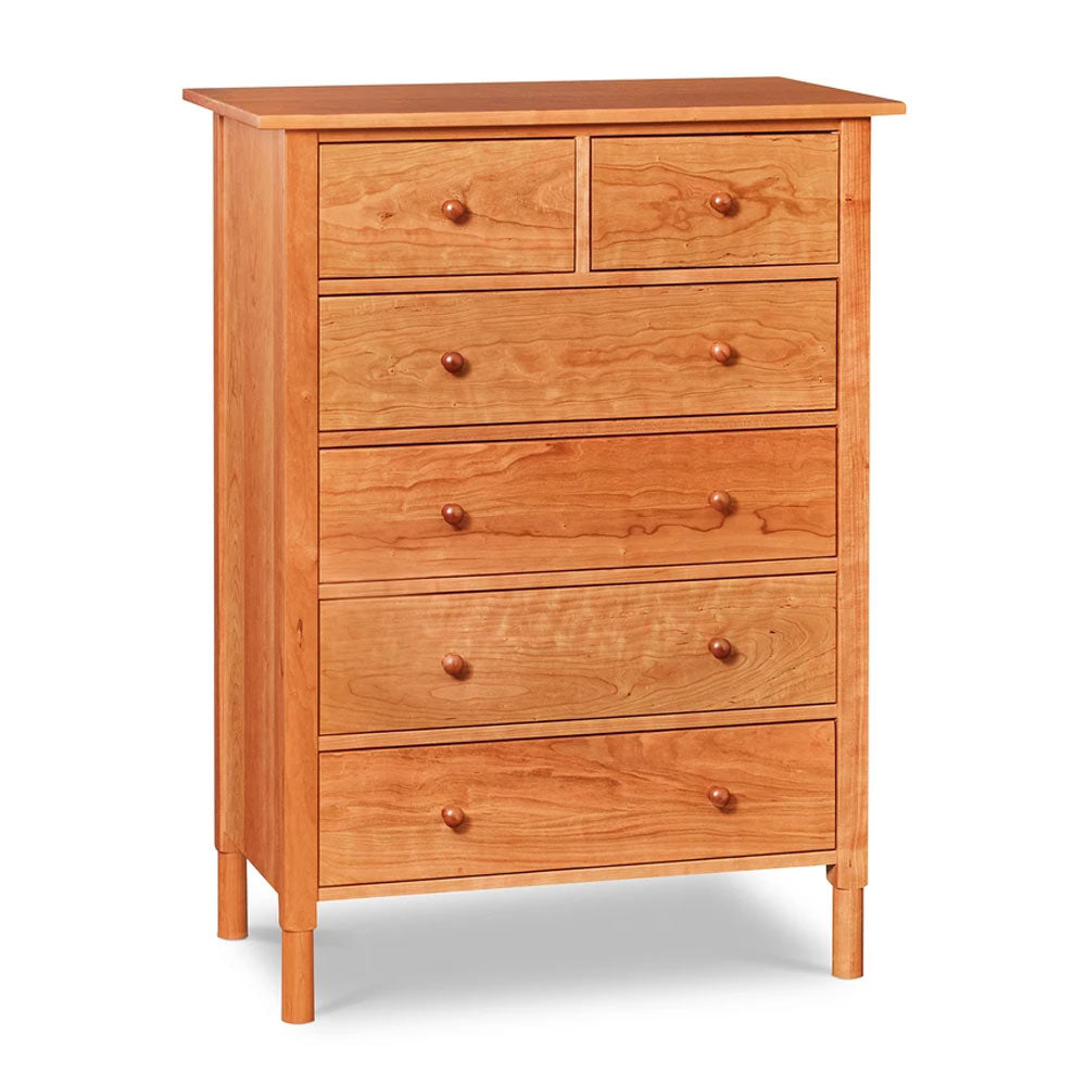 Modern interpretation of a classic Shaker style chest with six drawers and rounded legs, in solid cherry wood