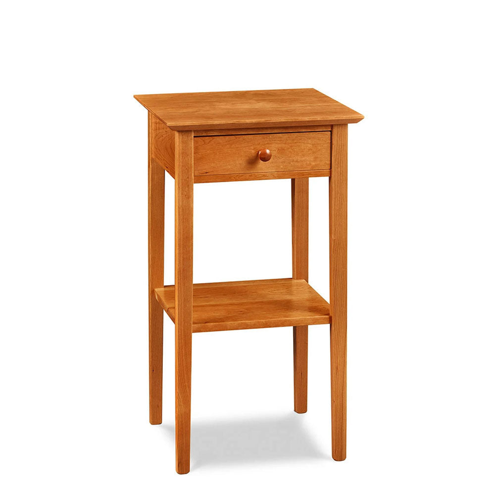 Simple Shaker nightstand with one drawer, shelf, and tapered legs, in cherry wood, from Maine's Chilton Furniture Co.