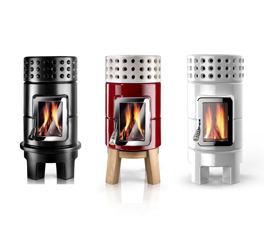 Three modern Scandinavian Style wood-burning stoves, shown in black, red and white
