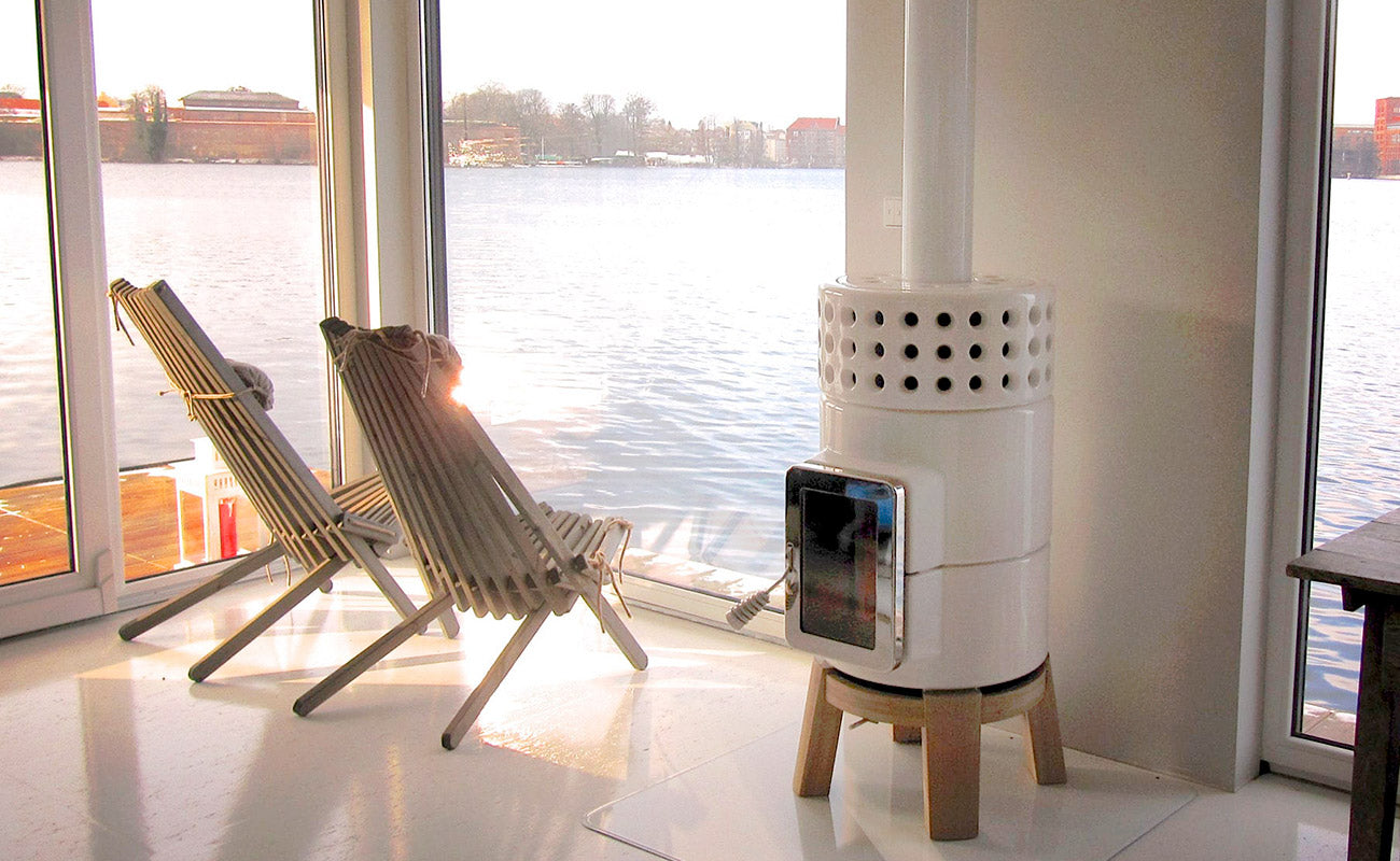 Modern Scandinavian Style wood-burning stove, in white with oak wood base